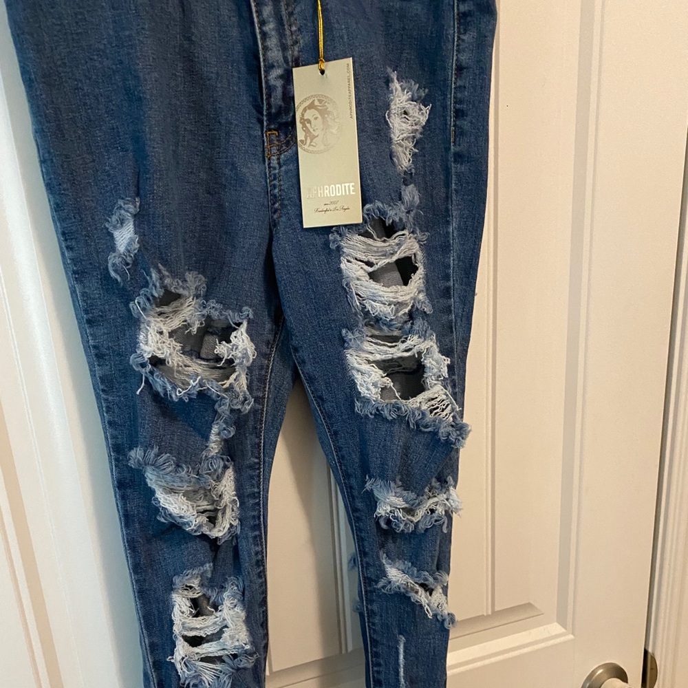 Ripped Jeans - image 1